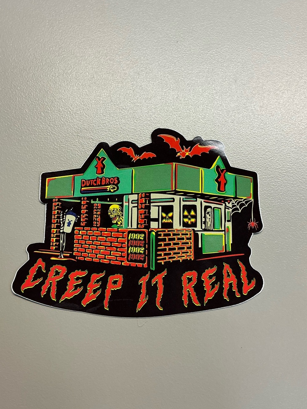Dutch Bros Green and Orange Halloween Sticker - Creep It Real Graphic